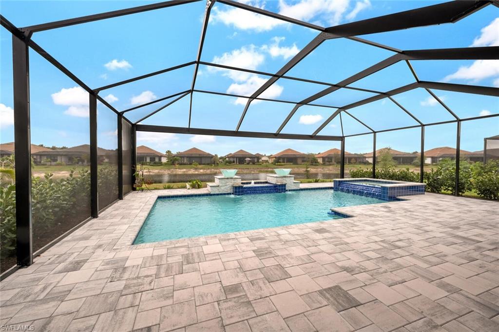 8416 Rosa Court Naples, FL 34114 - Photo 21 of 33 a view of a swimming pool with a porch