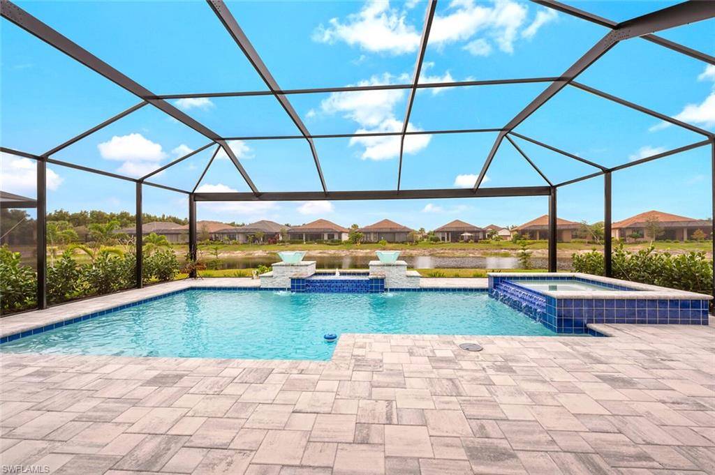 8416 Rosa Court Naples, FL 34114 - Photo 22 of 33 a view of swimming pool with lake view