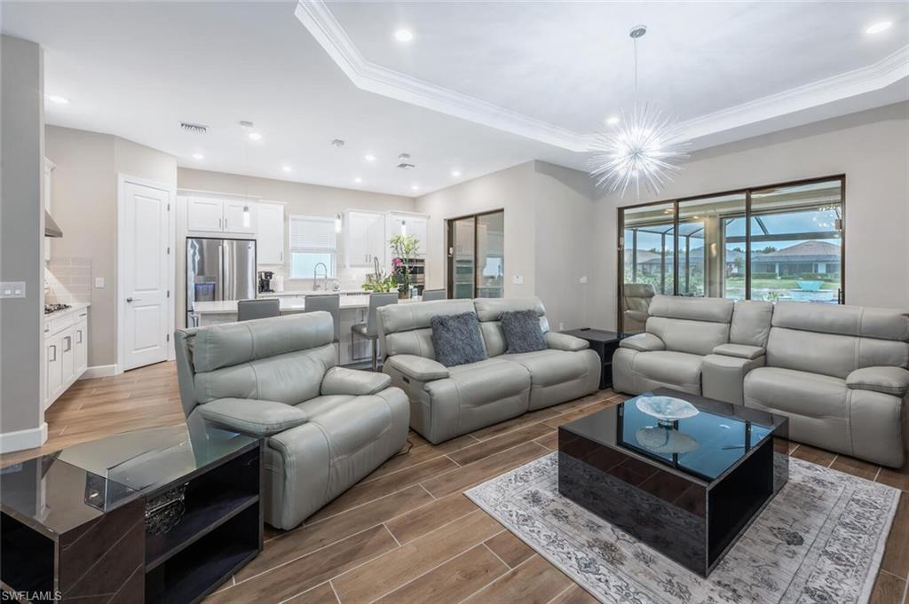 8416 Rosa Court Naples, FL 34114 - Photo 5 of 33 a living room with furniture and a large window