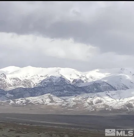 a view of ocean and a mountain