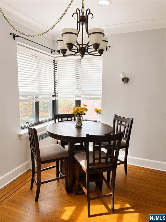 100 Prospect Avenue, Unit 5H Hackensack, NJ 07601 - Photo 11 of 17 a view of a dining room with furniture window and wooden floor