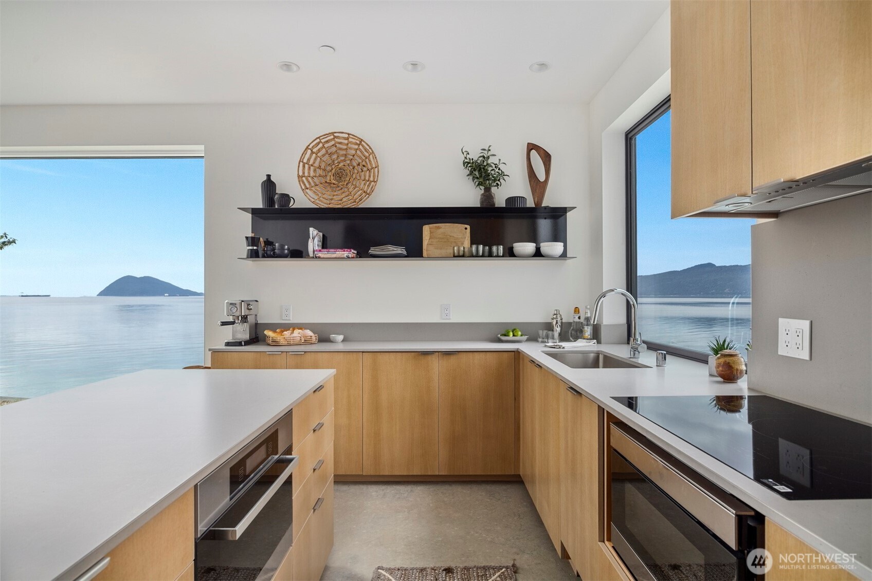 4869 Mercer Road Bow, WA 98232 - Photo 11 of 34 a kitchen with a sink a stove and cabinets