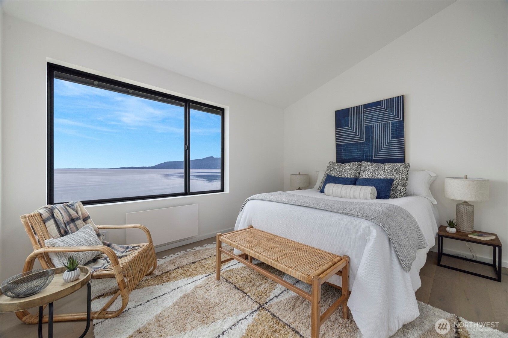 4869 Mercer Road Bow, WA 98232 - Photo 14 of 34 a bedroom with a bed and chair