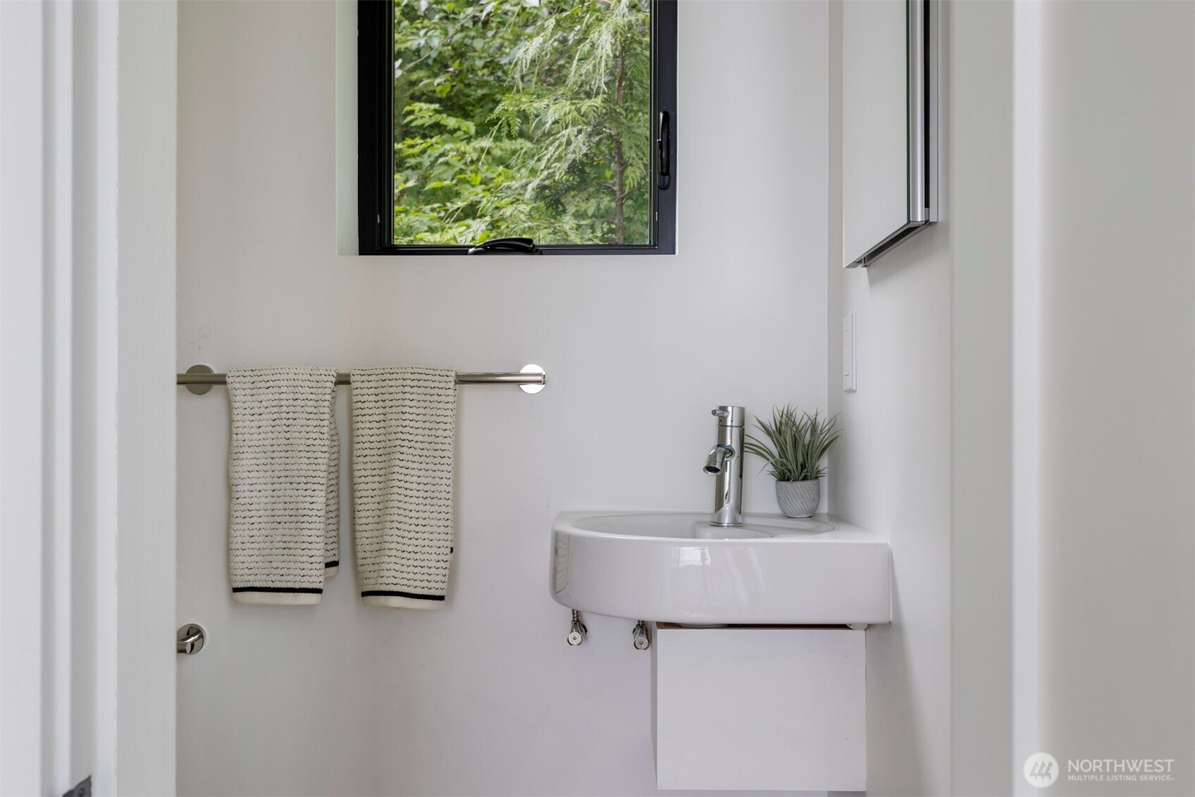 4869 Mercer Road Bow, WA 98232 - Photo 15 of 34 a bathroom with a sink and a mirror
