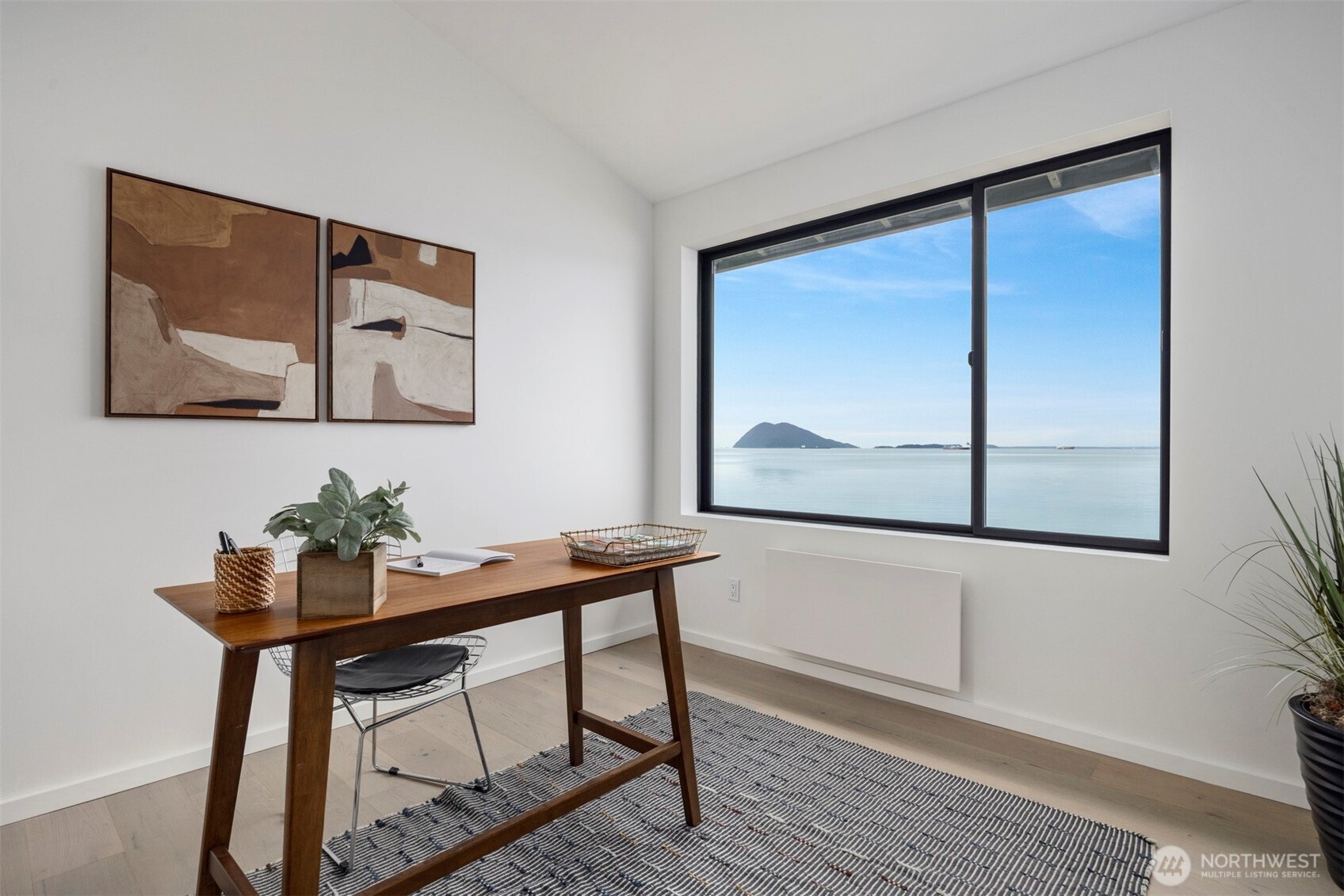 4869 Mercer Road Bow, WA 98232 - Photo 18 of 34 a view of a dining room with furniture window and wooden floor