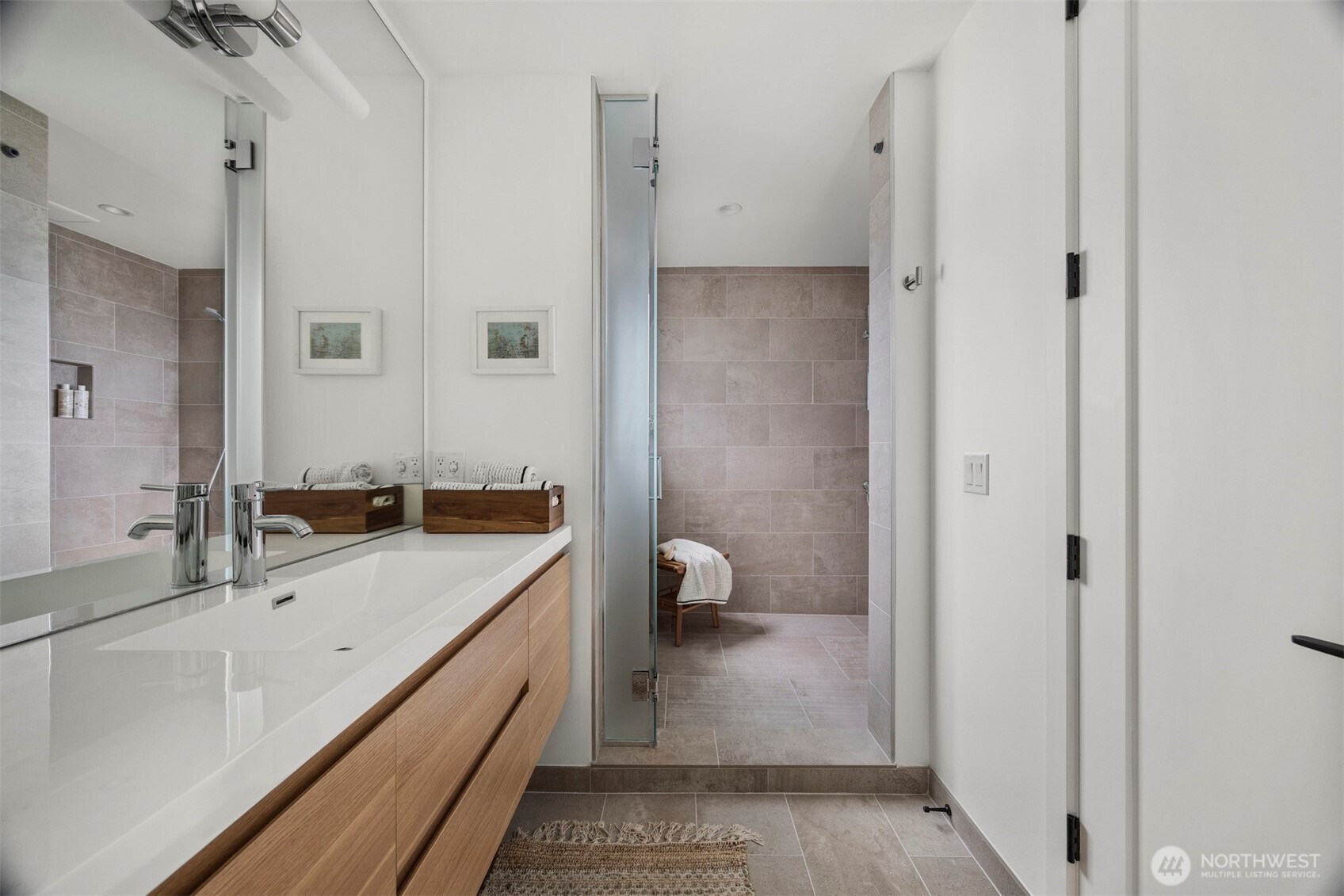 4869 Mercer Road Bow, WA 98232 - Photo 19 of 34 a bathroom with a double vanity sink and mirror with shower