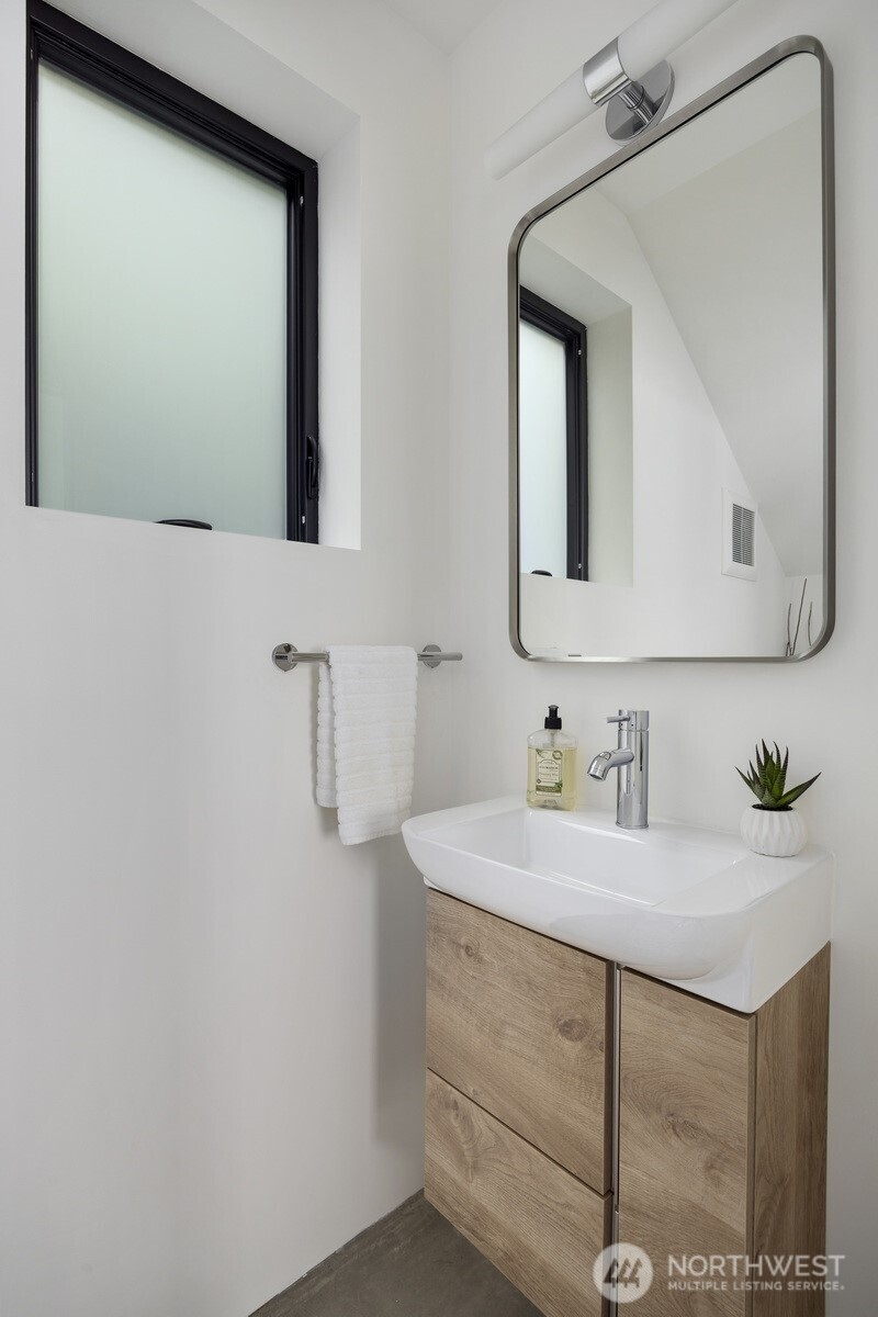 4869 Mercer Road Bow, WA 98232 - Photo 21 of 34 a bathroom with a sink vanity and a mirror