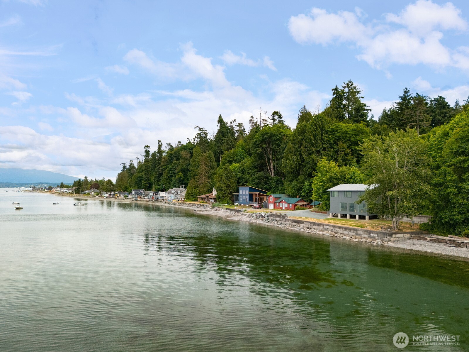 4869 Mercer Road Bow, WA 98232 - Photo 27 of 34 a view of a lake with houses