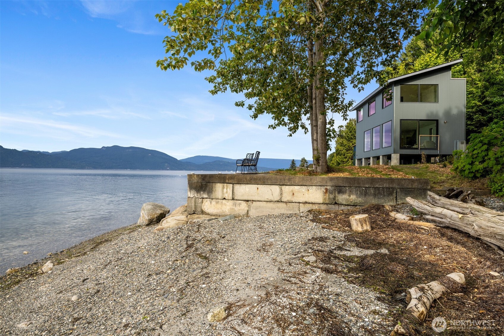 4869 Mercer Road Bow, WA 98232 - Photo 9 of 34 a view of a lake with houses in the background