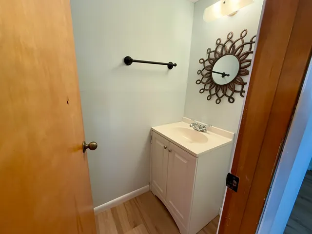 a bathroom with a sink and vanity