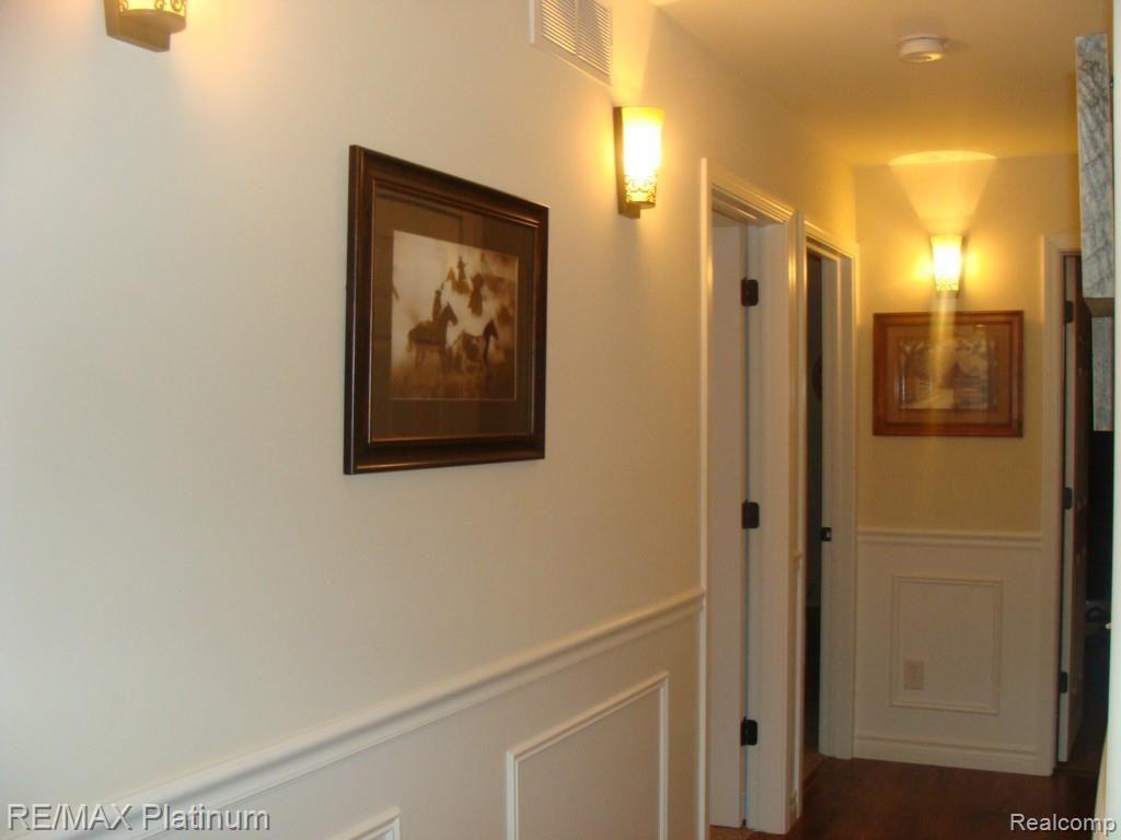 4720 Hogback Road Fowlerville, MI 48836 - Photo 15 of 18 Wide Hall to bedrooms