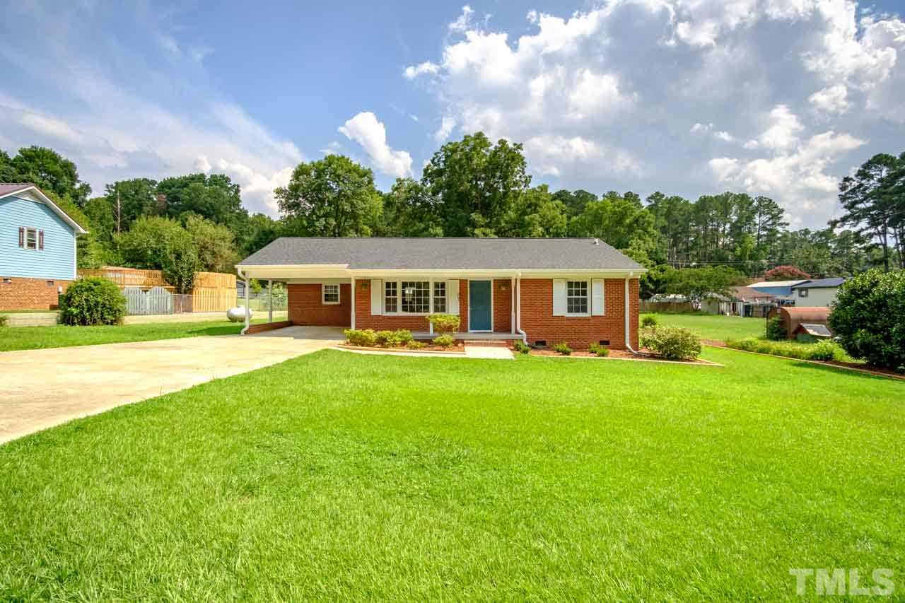 807 Colonial Drive Raleigh, NC 27603 - Photo 1 of 25 a front view of a house with garden