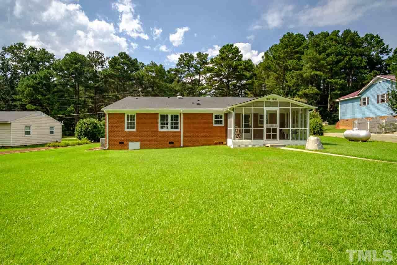 807 Colonial Drive Raleigh, NC 27603 - Photo 3 of 25 a front view of a house with garden