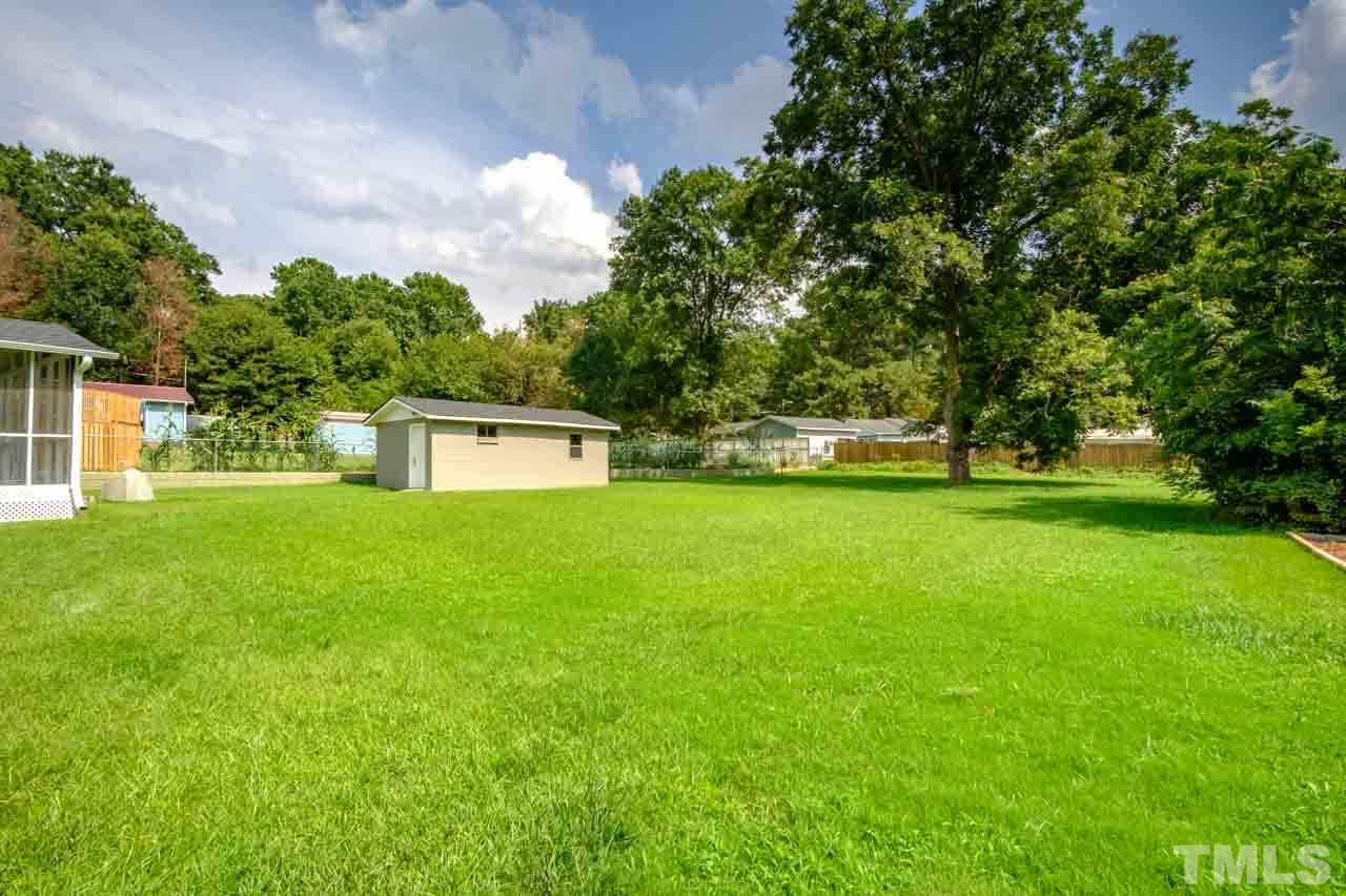 807 Colonial Drive Raleigh, NC 27603 - Photo 23 of 25 a house view with a garden space