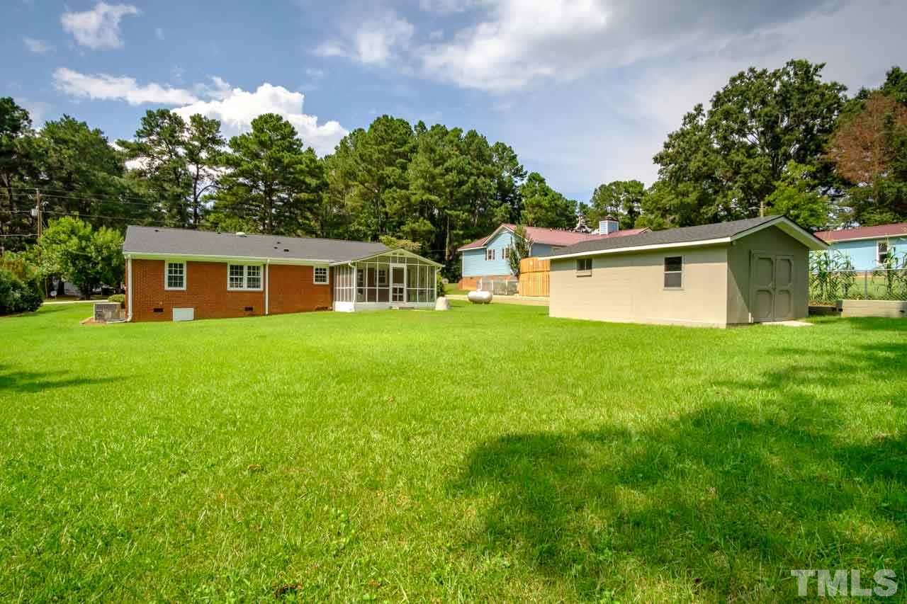 807 Colonial Drive Raleigh, NC 27603 - Photo 4 of 25 a front view of house with yard and green space