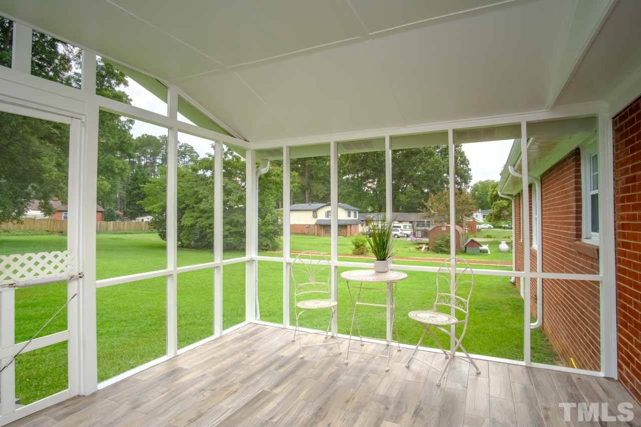 807 Colonial Drive Raleigh, NC 27603 - Photo 6 of 25 a view of a house with backyard and porch