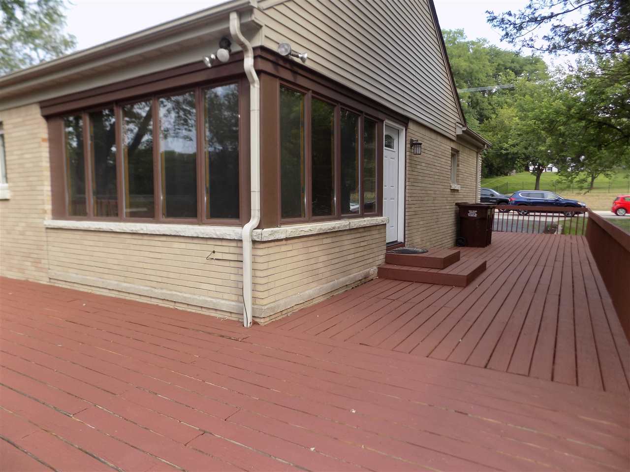 4315 Spring Creek Road Rockford, IL 61107 - Photo 36 of 39 a view of a house with a wooden deck