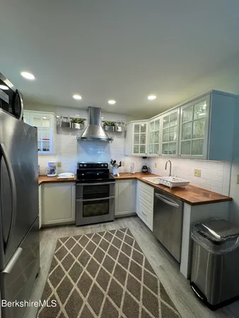 a kitchen with a sink and a window