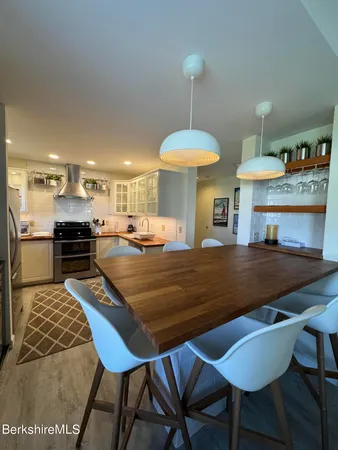 a kitchen with a sink and large window