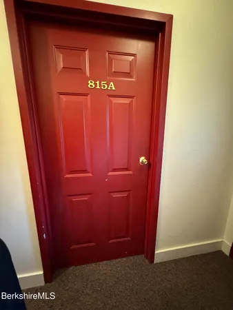 a room with lots of different colored cloths