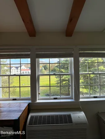a view of hallway with seating area