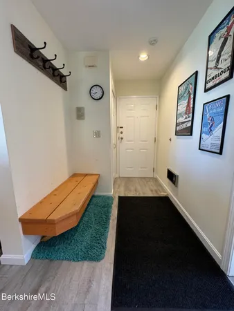 a bathroom with a window and a shower