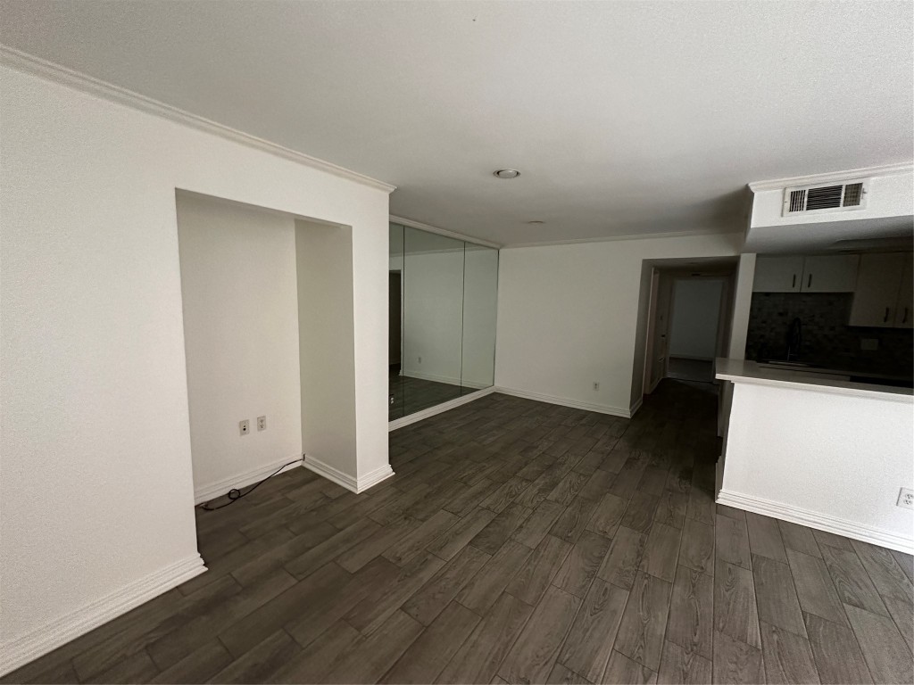 1909 Brun Street, Unit 9 Houston, TX 77019 - Photo 19 of 19 an empty room with wooden floor and closet