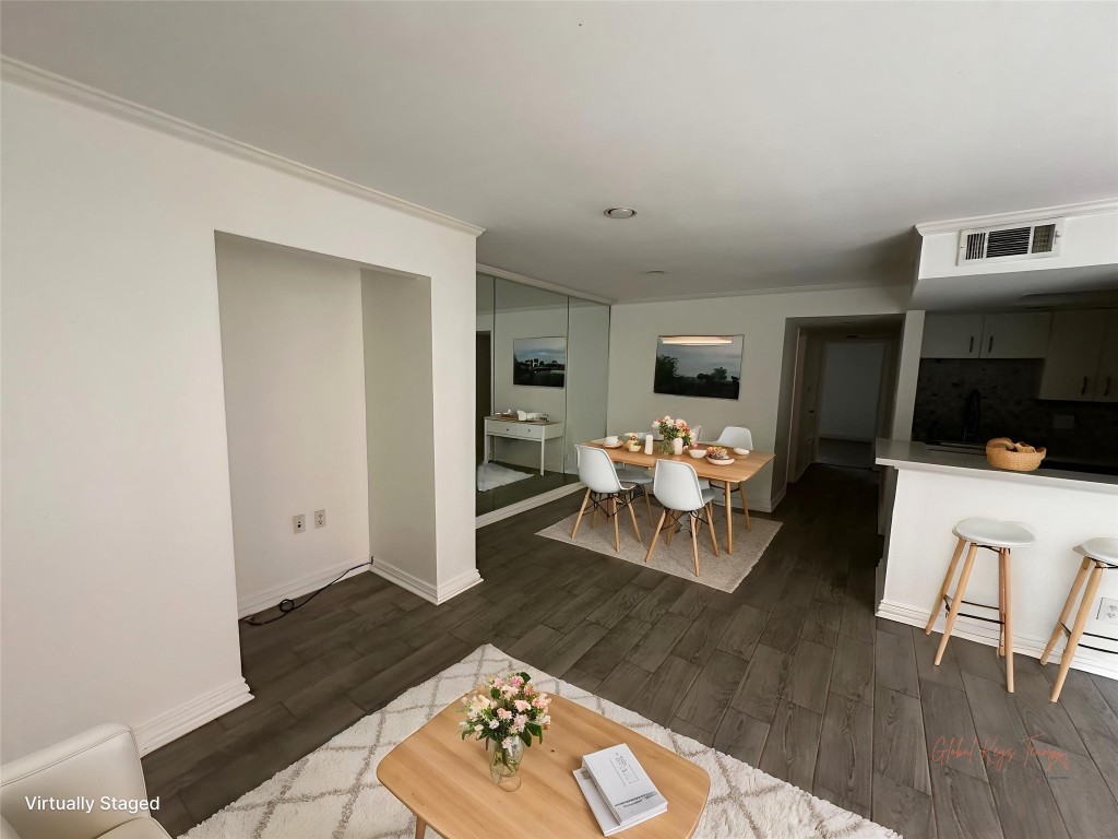 1909 Brun Street, Unit 9 Houston, TX 77019 - Photo 2 of 19 a living room with furniture and a flat screen tv