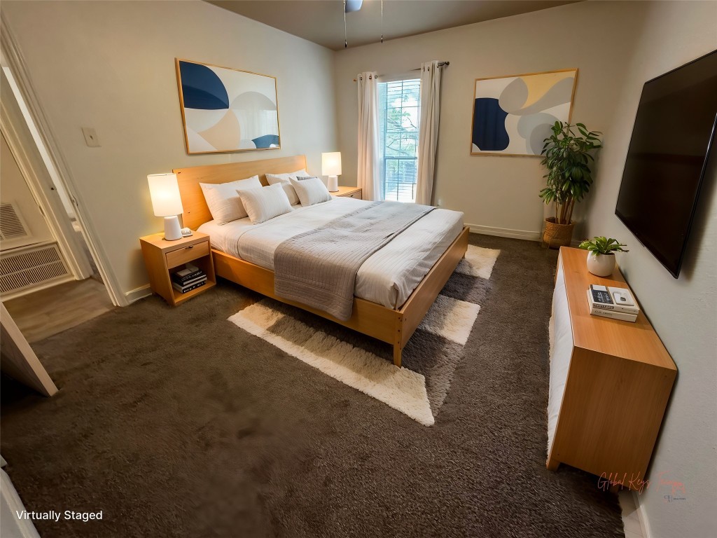 1909 Brun Street, Unit 9 Houston, TX 77019 - Photo 3 of 19 a bedroom with a bed a flat screen tv and dresser