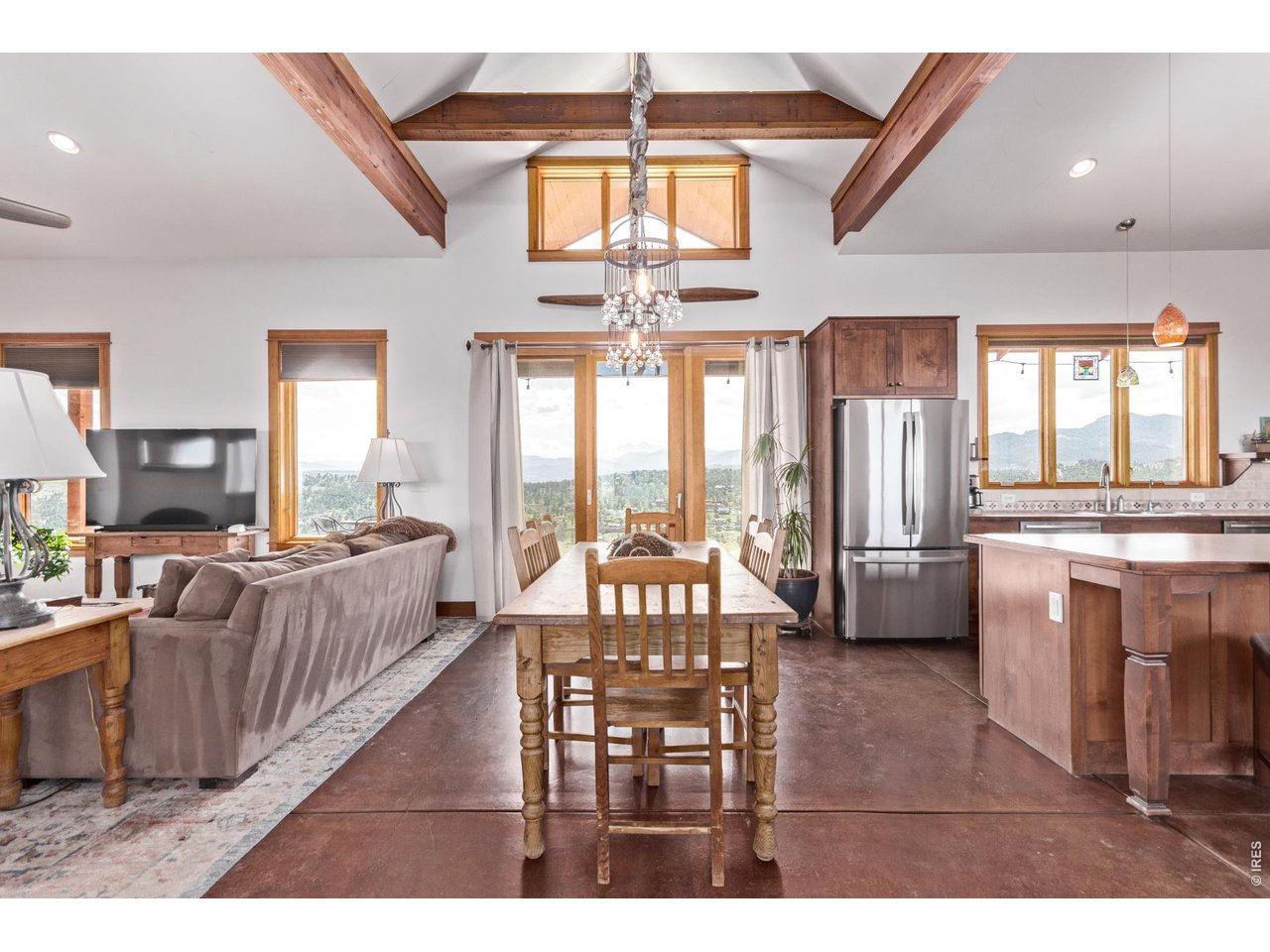 399 Northview Road Berthoud, CO 80513 - Photo 12 of 39 Sunlight flows in from all angles, making this space feel open, warm and inviting.