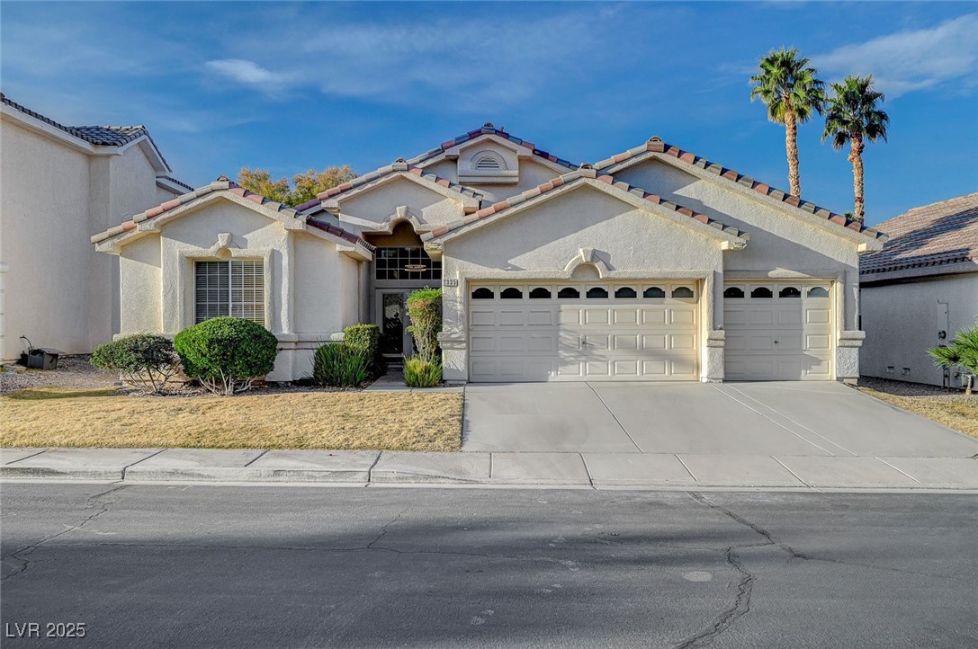 Mediterranean / spanish home with a tiled roof, st