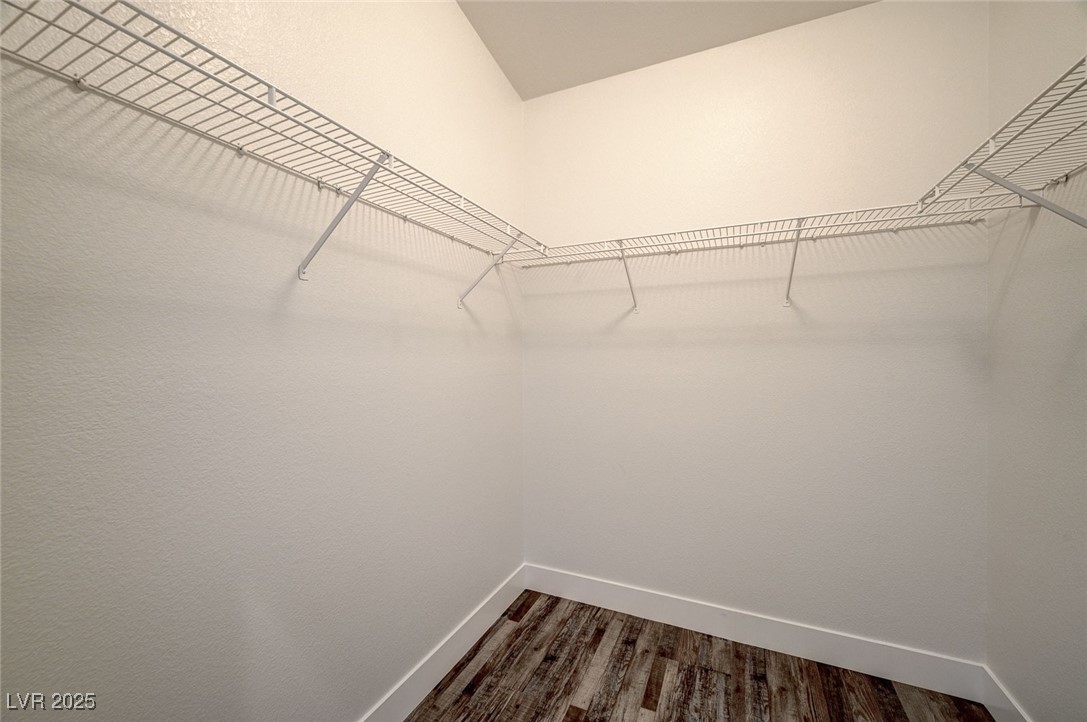 1335 Rolling Sunset Street Henderson, NV 89052 - Photo 12 of 72 Spacious closet with dark wood-style flooring