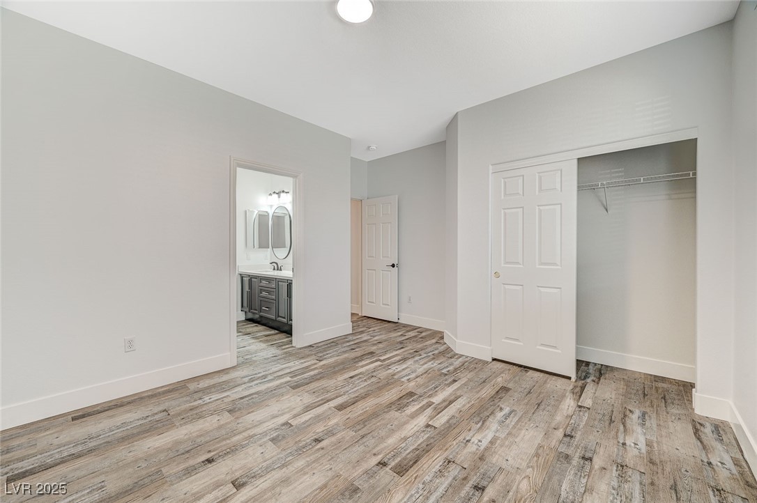 1335 Rolling Sunset Street Henderson, NV 89052 - Photo 14 of 72 Unfurnished bedroom with a sink, a closet, baseboa