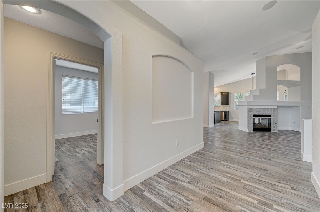 1335 Rolling Sunset Street Henderson, NV 89052 - Photo 18 of 72 Corridor with baseboards, light wood-style floorin