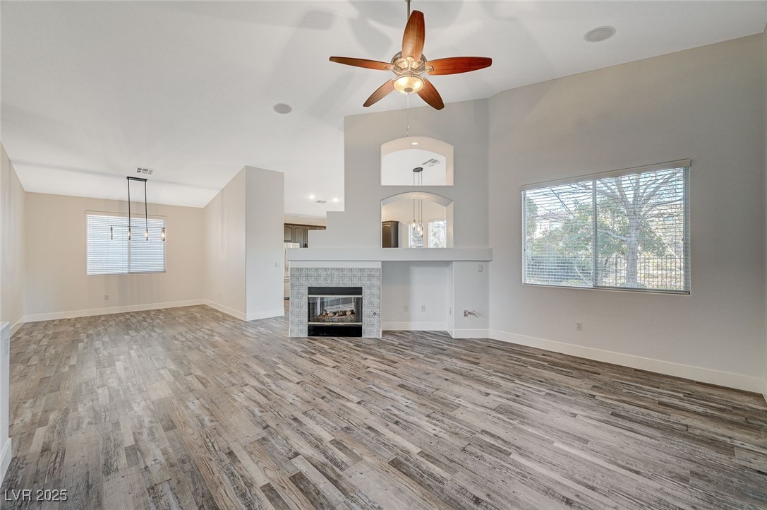 1335 Rolling Sunset Street Henderson, NV 89052 - Photo 21 of 72 Unfurnished living room with baseboards, wood fini
