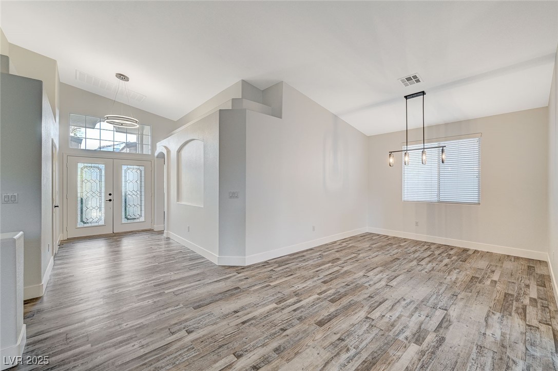 1335 Rolling Sunset Street Henderson, NV 89052 - Photo 23 of 72 Entryway with a notable chandelier, a healthy amou