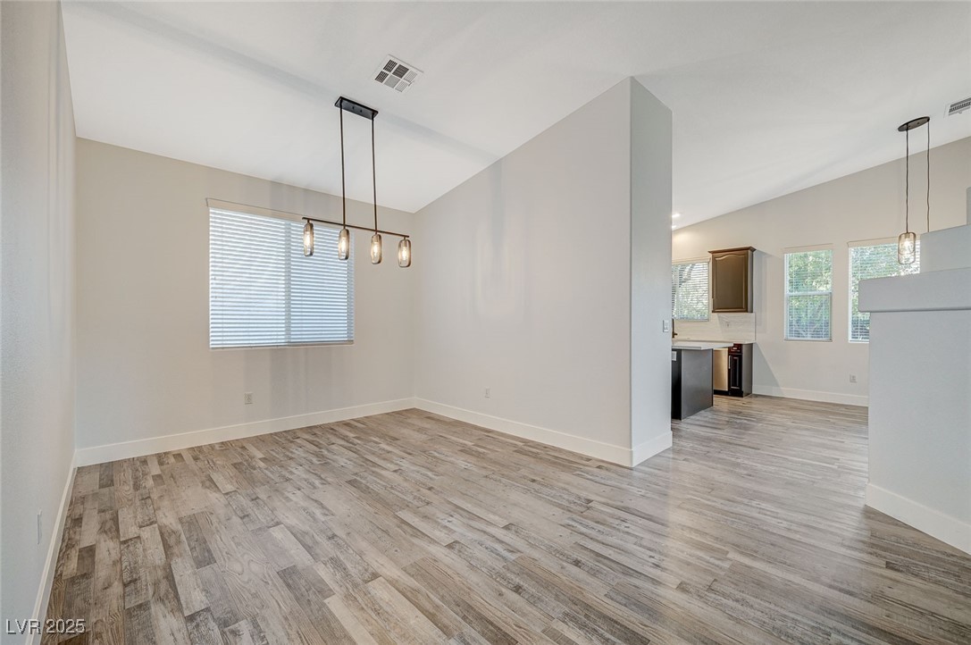 1335 Rolling Sunset Street Henderson, NV 89052 - Photo 24 of 72 Unfurnished dining area with light wood-type floor