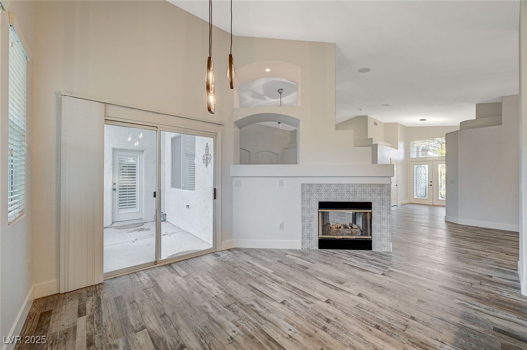 1335 Rolling Sunset Street Henderson, NV 89052 - Photo 28 of 72 Unfurnished living room with a tile fireplace, hig