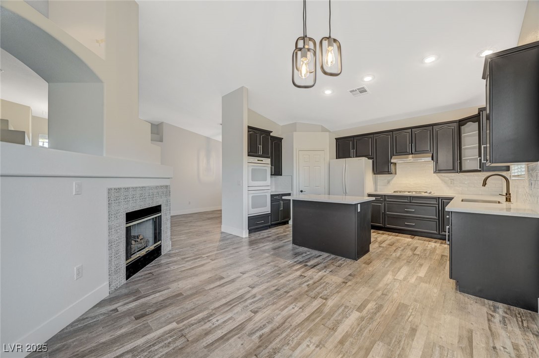 1335 Rolling Sunset Street Henderson, NV 89052 - Photo 29 of 72 Kitchen featuring visible vents, a sink, under cab