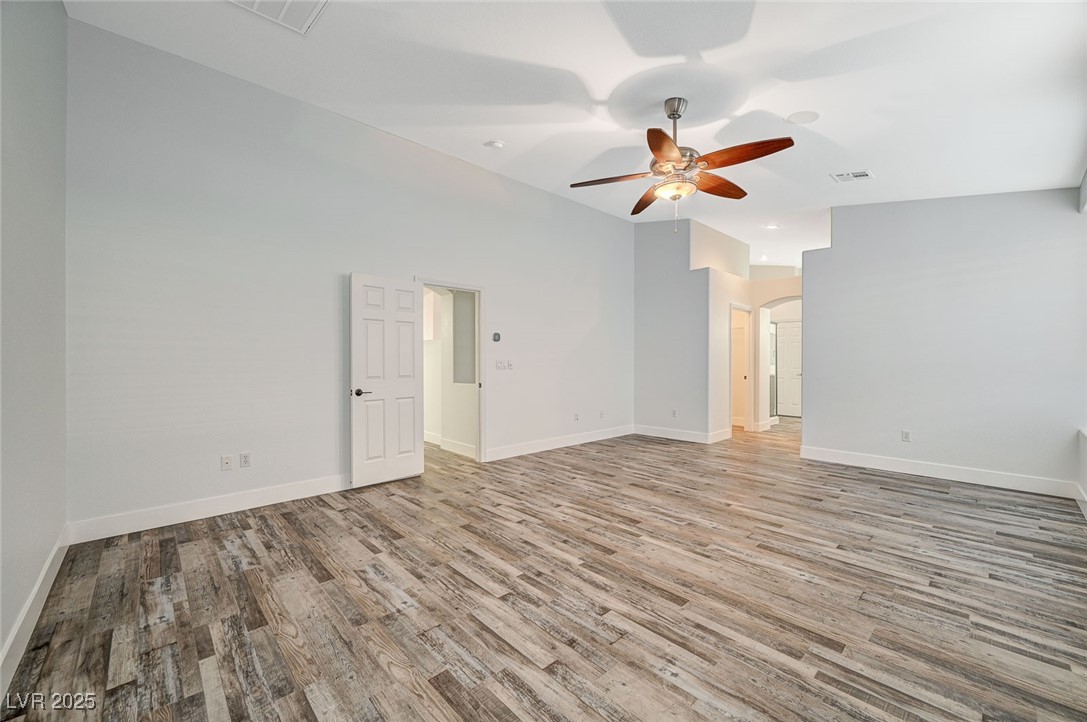 1335 Rolling Sunset Street Henderson, NV 89052 - Photo 33 of 72 Empty room featuring visible vents, arched walkway