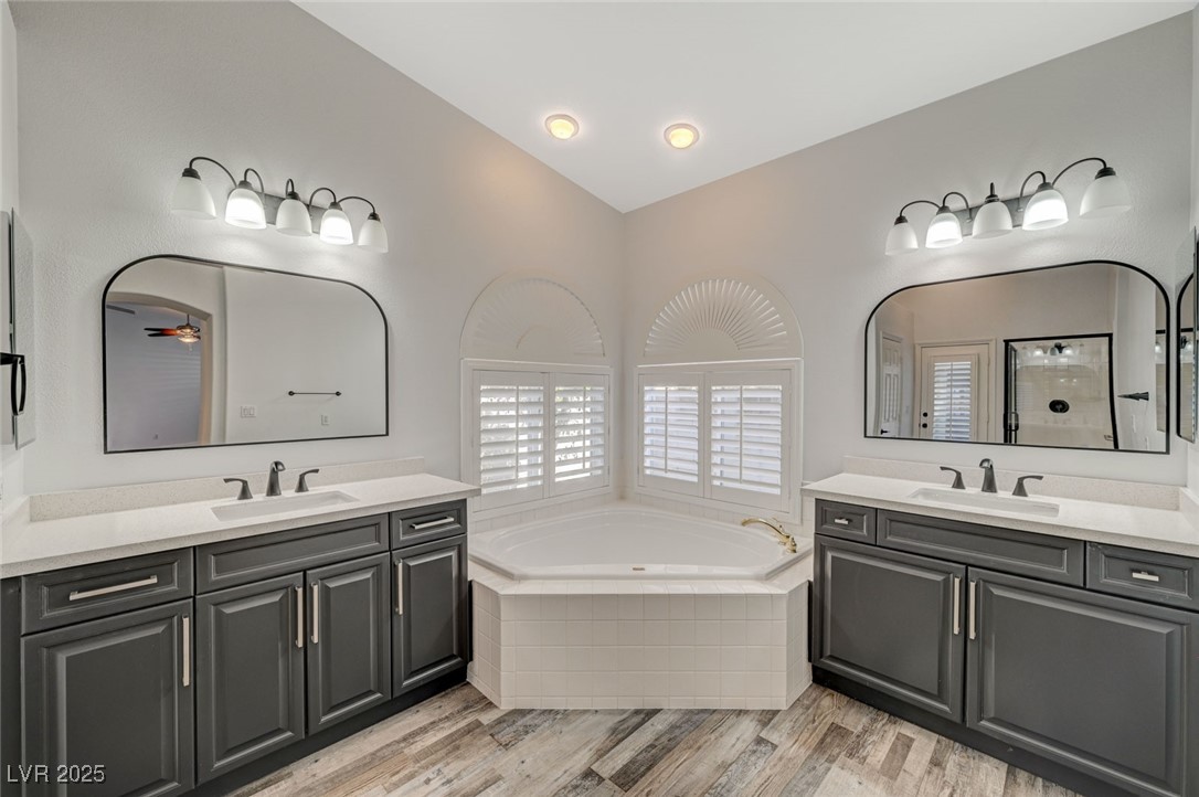 1335 Rolling Sunset Street Henderson, NV 89052 - Photo 34 of 72 Full bathroom with a garden tub, two vanities, woo
