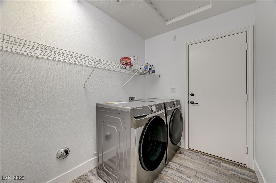 1335 Rolling Sunset Street Henderson, NV 89052 - Photo 37 of 72 Laundry room featuring washer and dryer, baseboard
