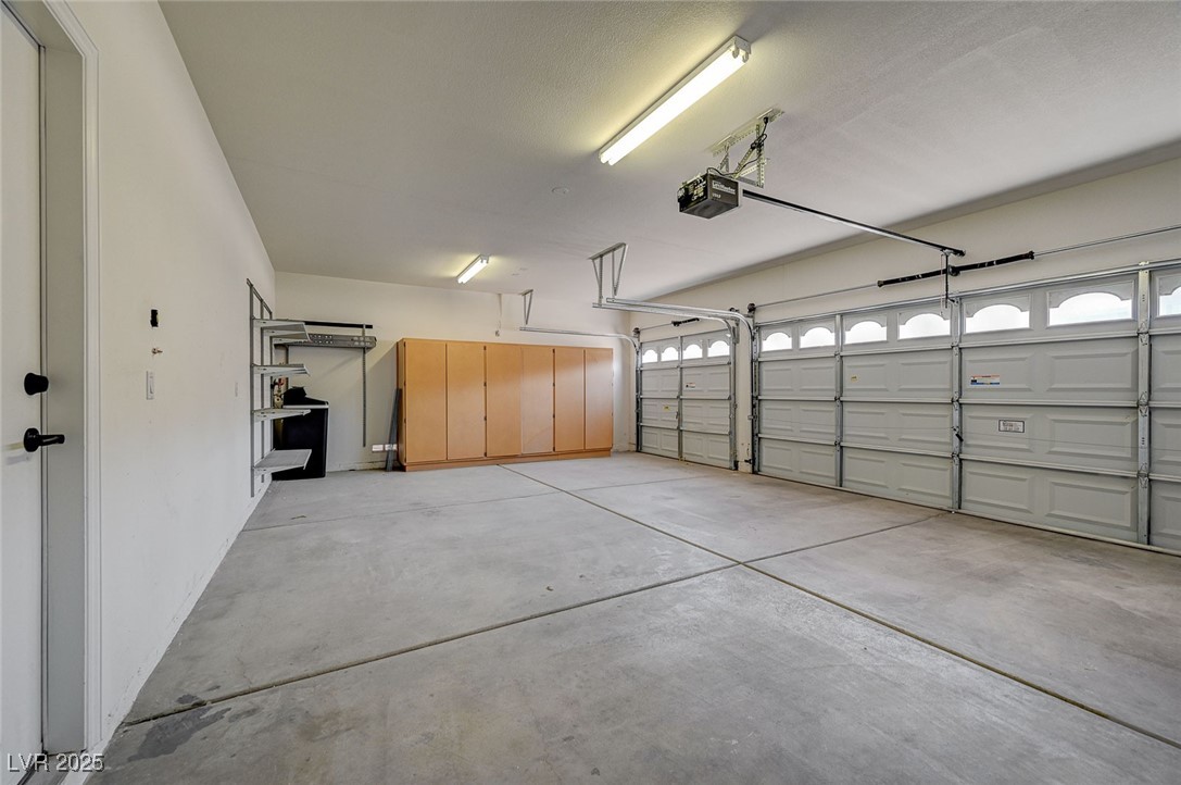 1335 Rolling Sunset Street Henderson, NV 89052 - Photo 38 of 72 Garage featuring a garage door opener