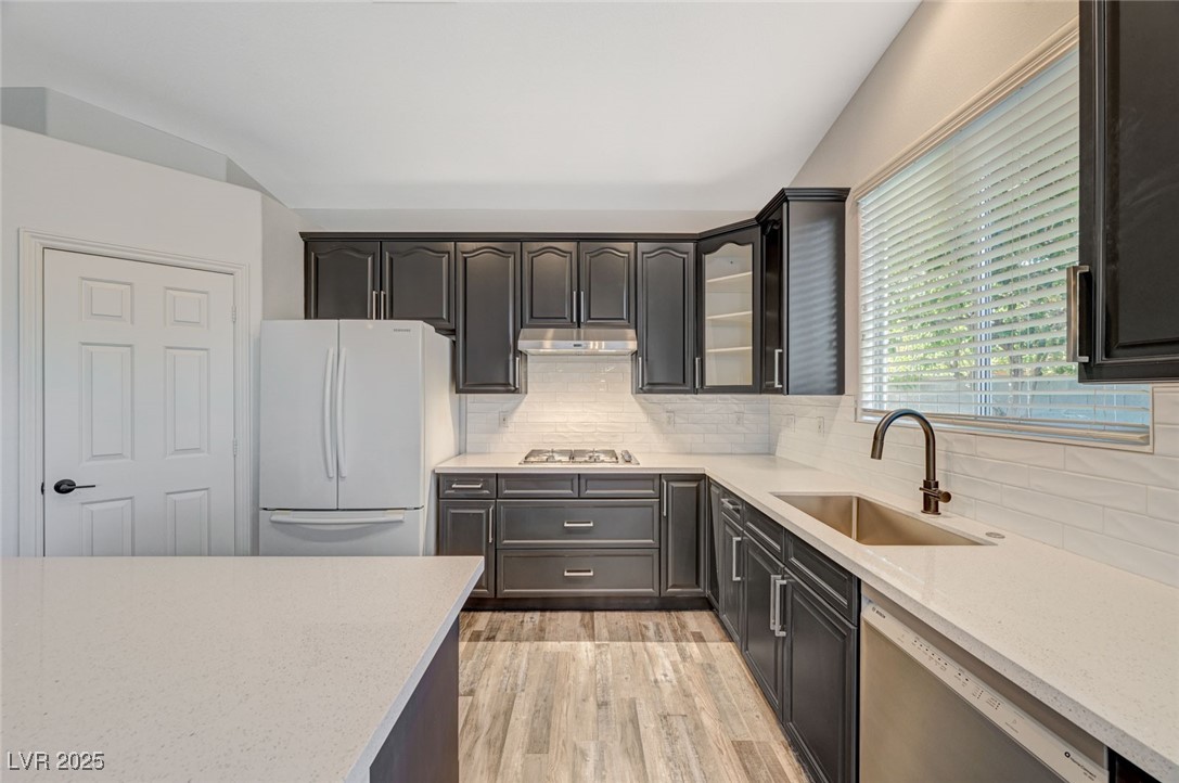 1335 Rolling Sunset Street Henderson, NV 89052 - Photo 42 of 72 Kitchen with light wood finished floors, under cab