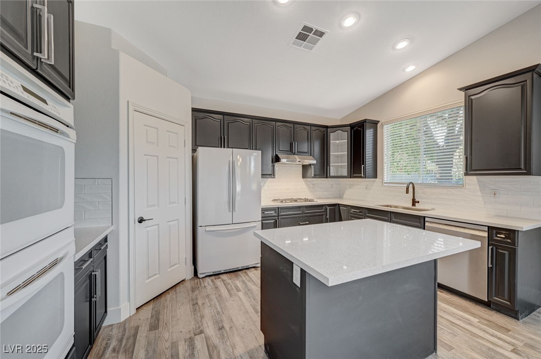 1335 Rolling Sunset Street Henderson, NV 89052 - Photo 43 of 72 Kitchen featuring visible vents, a sink, under cab