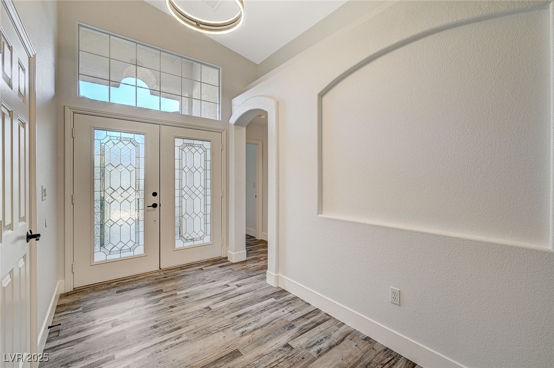 1335 Rolling Sunset Street Henderson, NV 89052 - Photo 48 of 72 Entryway with wood finished floors, baseboards, a