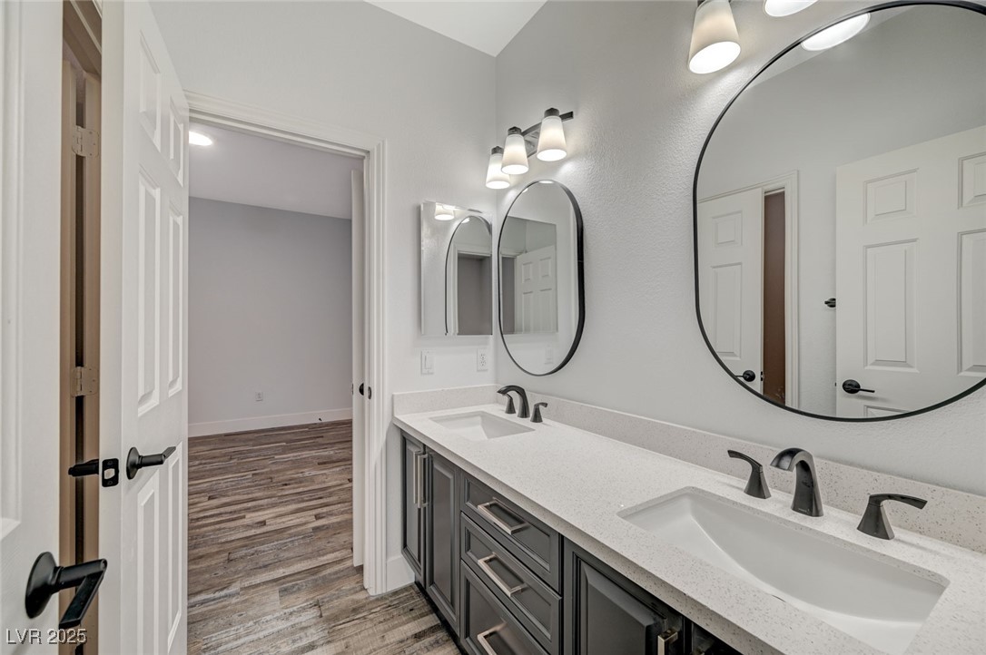 1335 Rolling Sunset Street Henderson, NV 89052 - Photo 51 of 72 Bathroom with double vanity, wood finished floors,