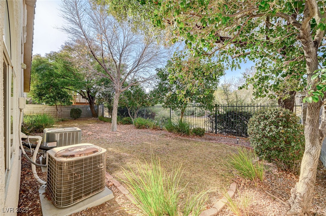 1335 Rolling Sunset Street Henderson, NV 89052 - Photo 55 of 72 View of yard with cooling unit and a fenced backya
