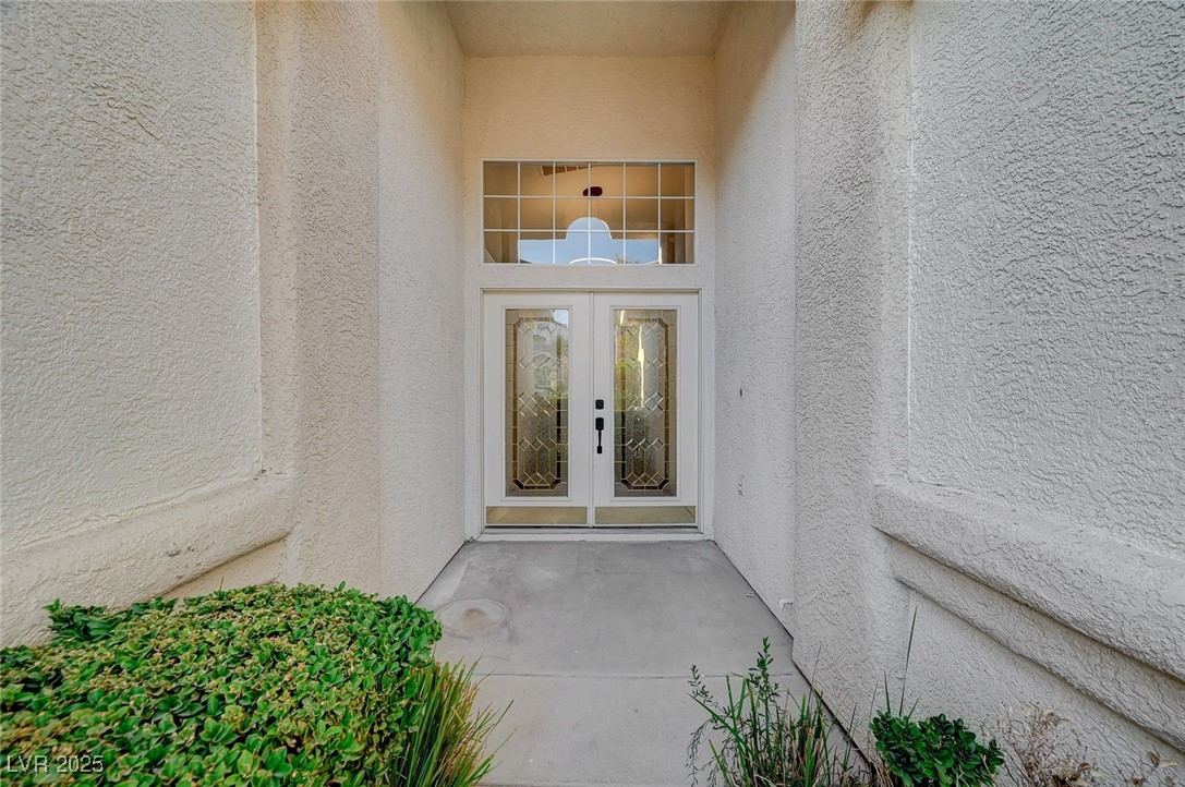 1335 Rolling Sunset Street Henderson, NV 89052 - Photo 6 of 72 Property entrance featuring stucco siding and fren