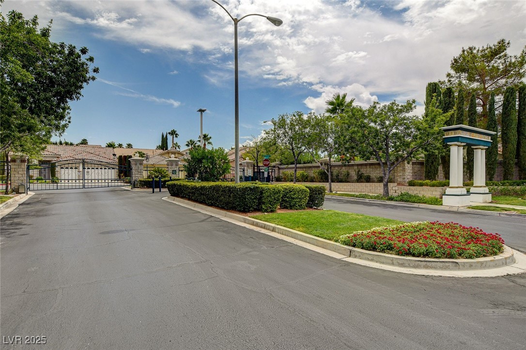 1335 Rolling Sunset Street Henderson, NV 89052 - Photo 62 of 72 View of road with street lighting, a gate, curbs,